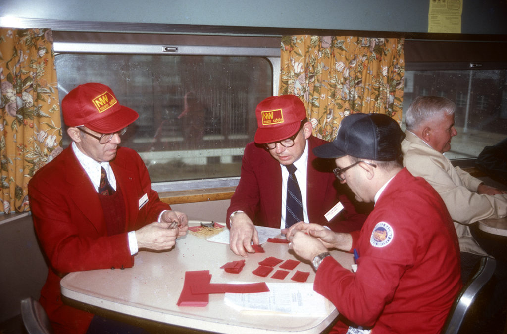 From left: Julien Sacks, Carl Jensen and David Helmer, counting tickets in car 1148. Photo: Dorr Tucker